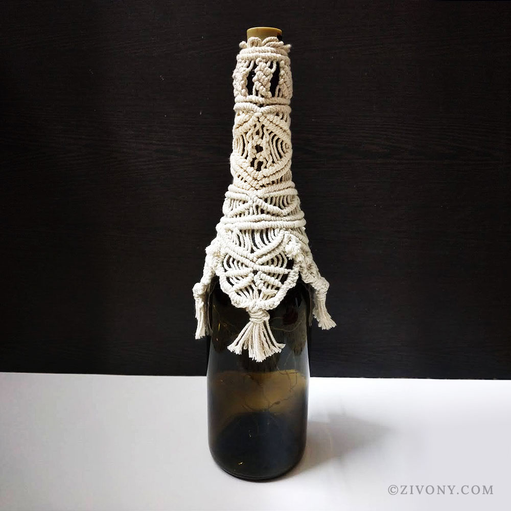 half macrame covered bottle lamp without lights on